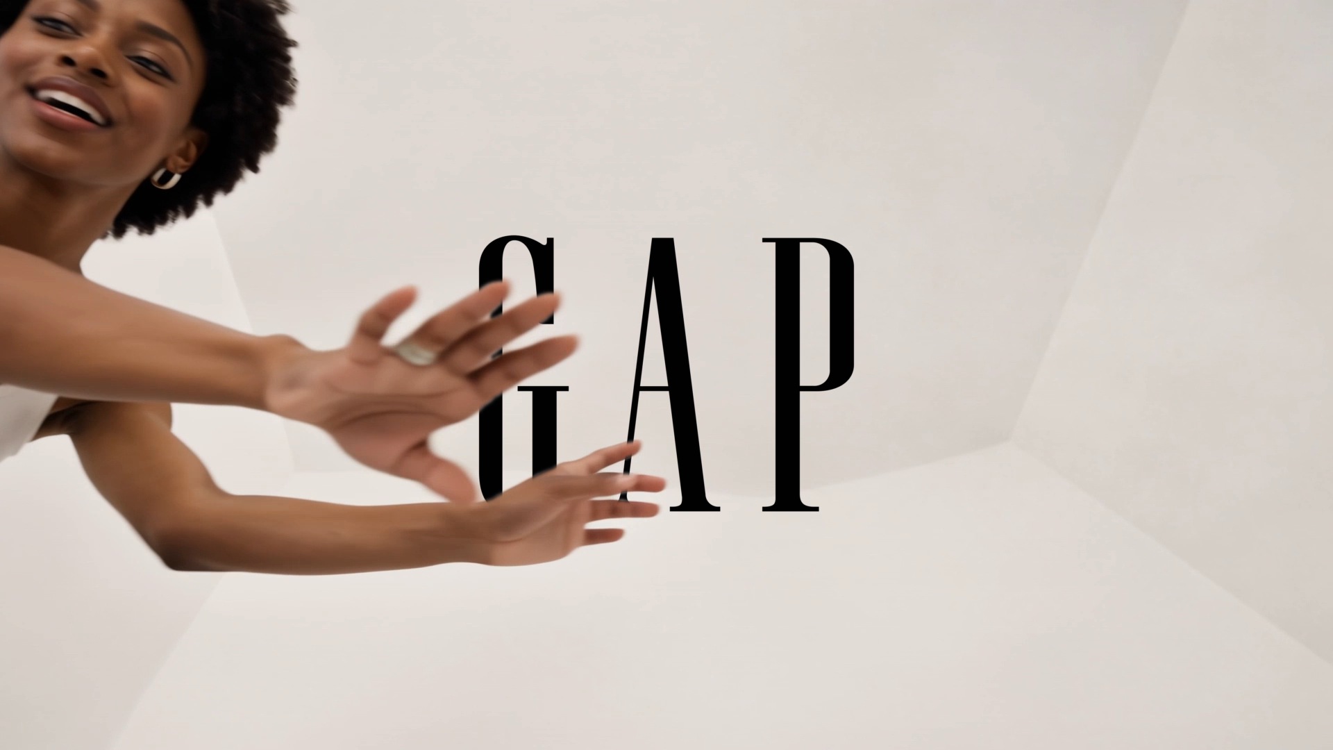The Gap wordmark appearing behind the dancer’s moving arms in the final shot