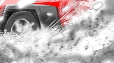 Original Jeep treatment drawing: A close view of a wheel pushing through snow