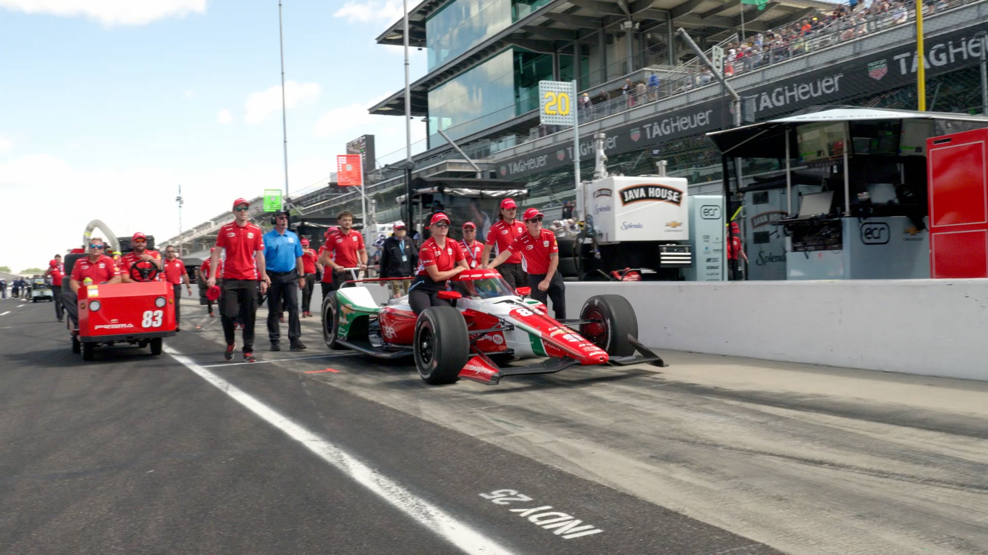 PREMA Racing crew pushing the No. 83 INDYCAR down pit lane at Indianapolis